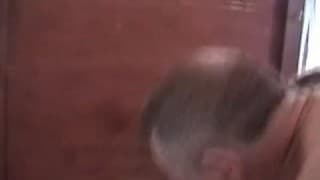 A blonde dominatrix keeps husband locked in a cage