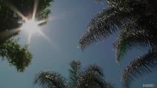 A pretty brunette enjoys a massage outside