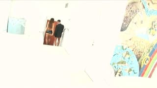 A sexy brunette gets two hard dicks