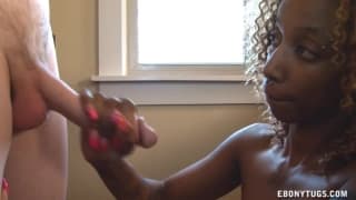 She’s a pretty shy black girl wanking him off