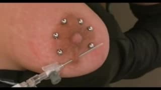 They put several piercings on her tits