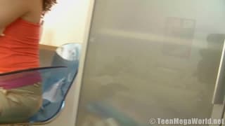 This curly haired teen is home alone masturbating