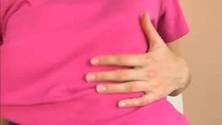 This young brunette is masturbating home alone