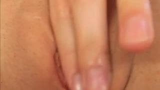 Young brunette masturbates in bed alone